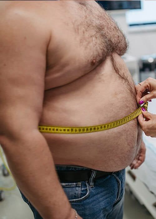 Measuring waist for health assessment or evaluation.